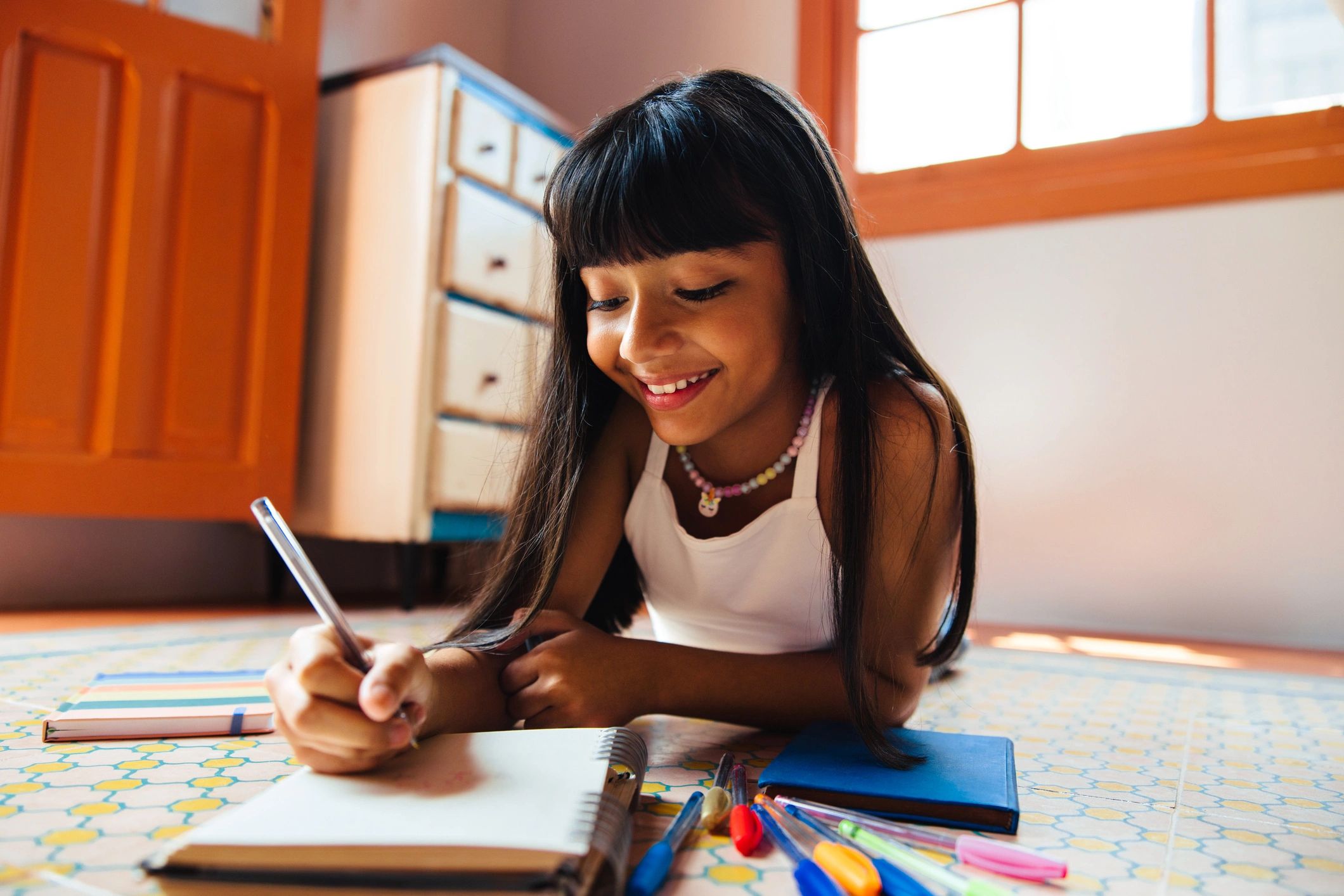 happy children writing books colorful